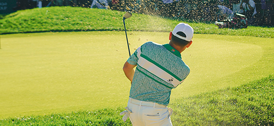 a man swinging a golf club