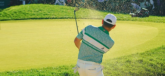 a man swinging a golf club