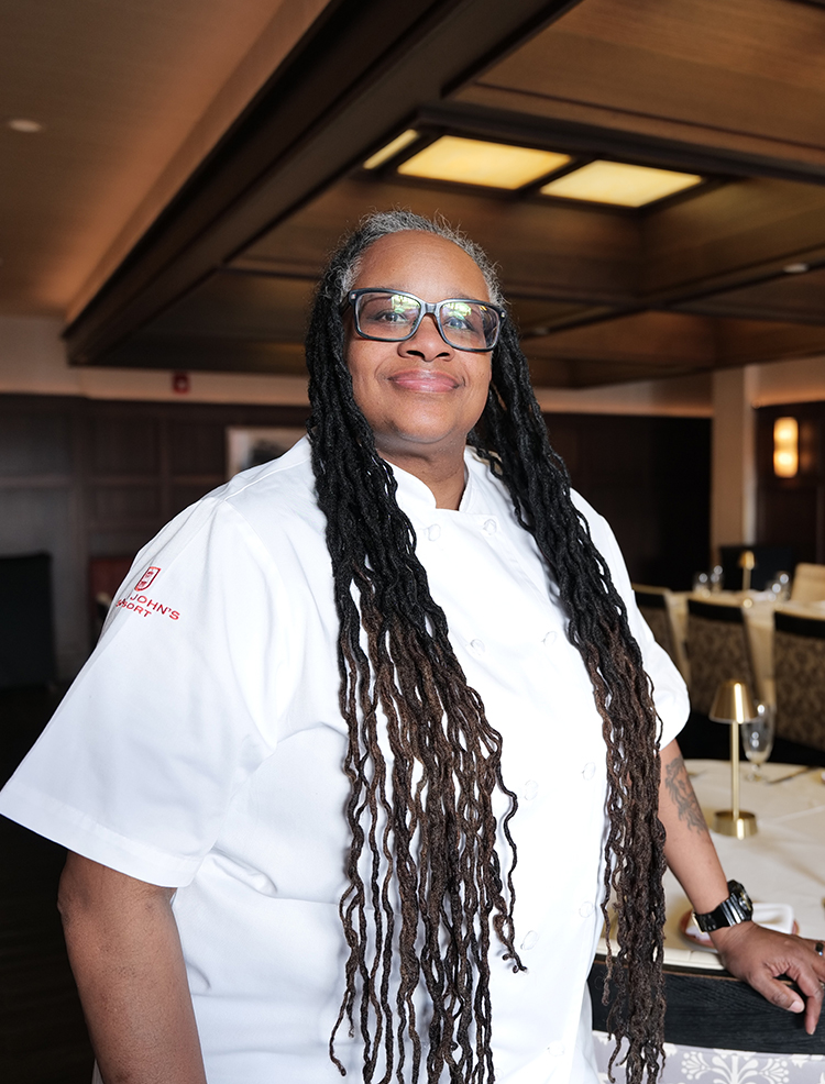 a woman wearing a chef's uniform