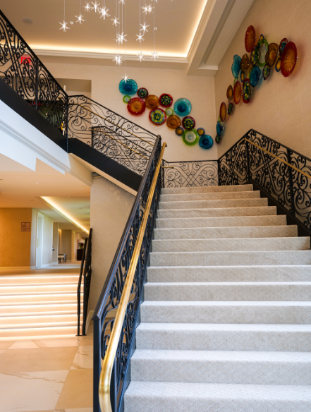 a staircase with a black railing