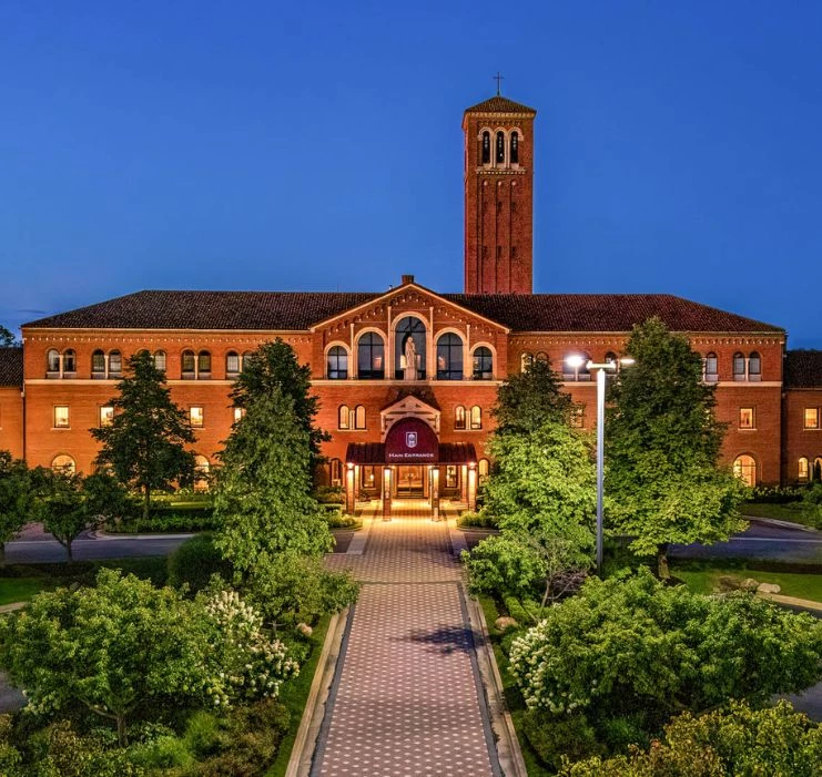 a building with a tower and trees