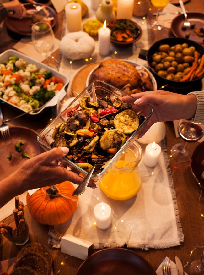 a person holding a bowl of food