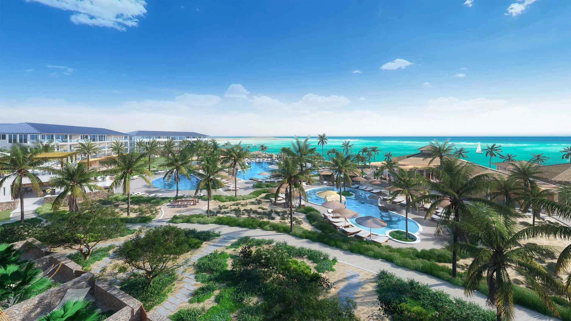 a resort with palm trees and a pool