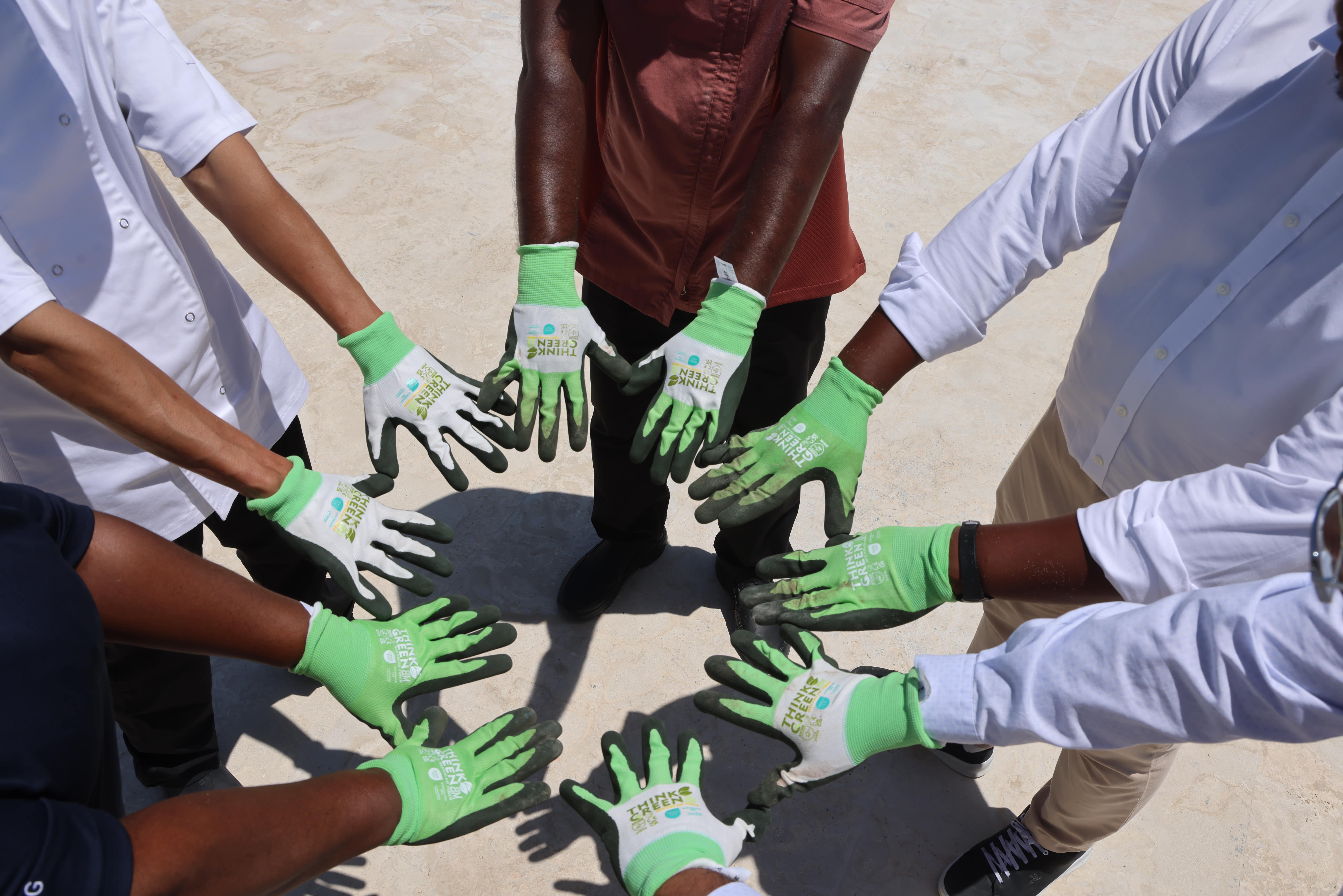 a group of people wearing gloves