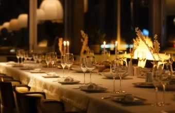 a table with wine glasses and candles