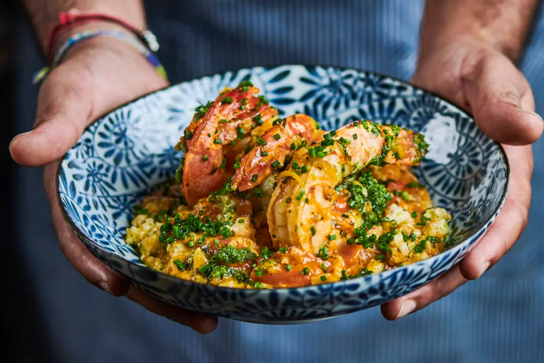 a person holding a bowl of food