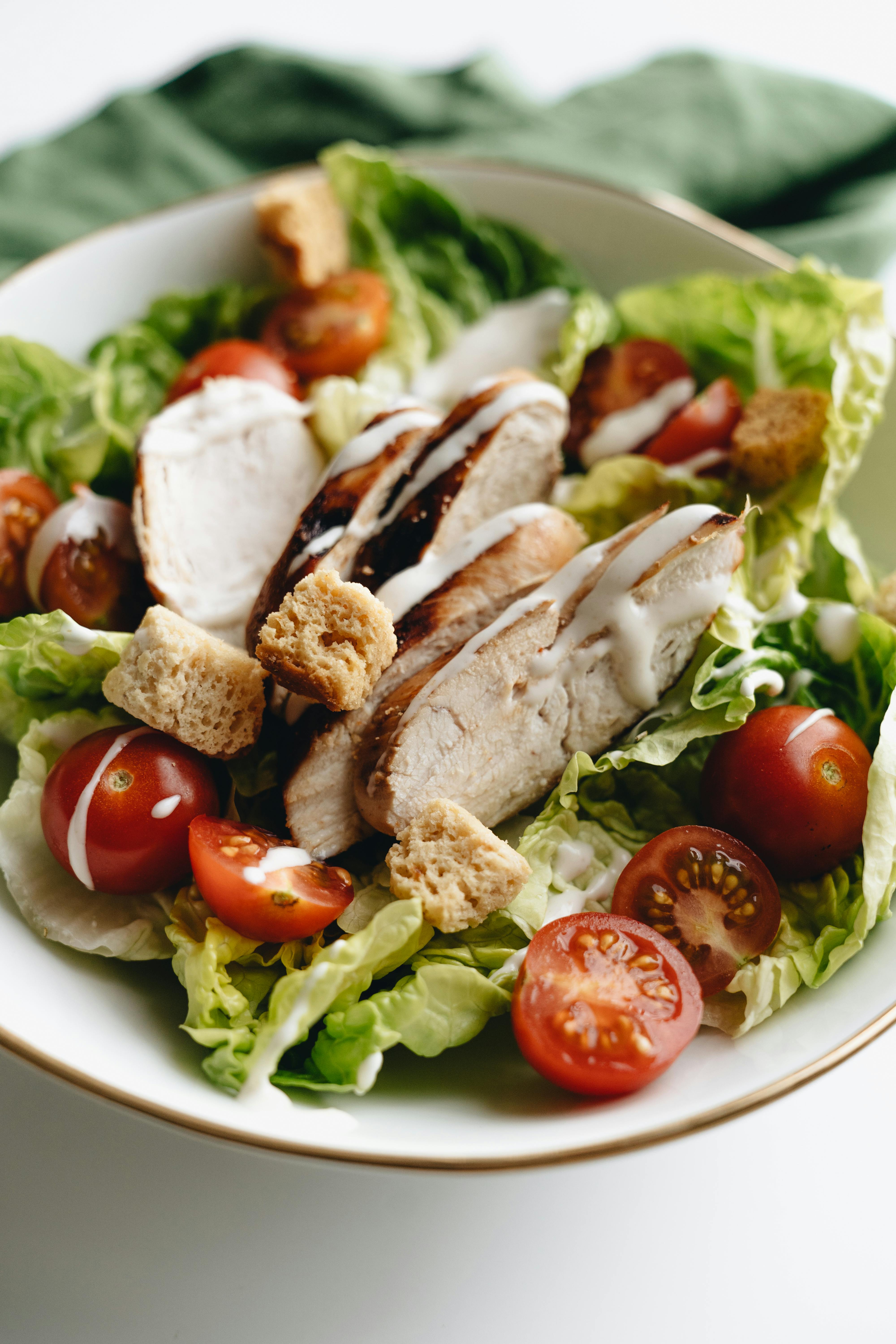 a salad with chicken and croutons