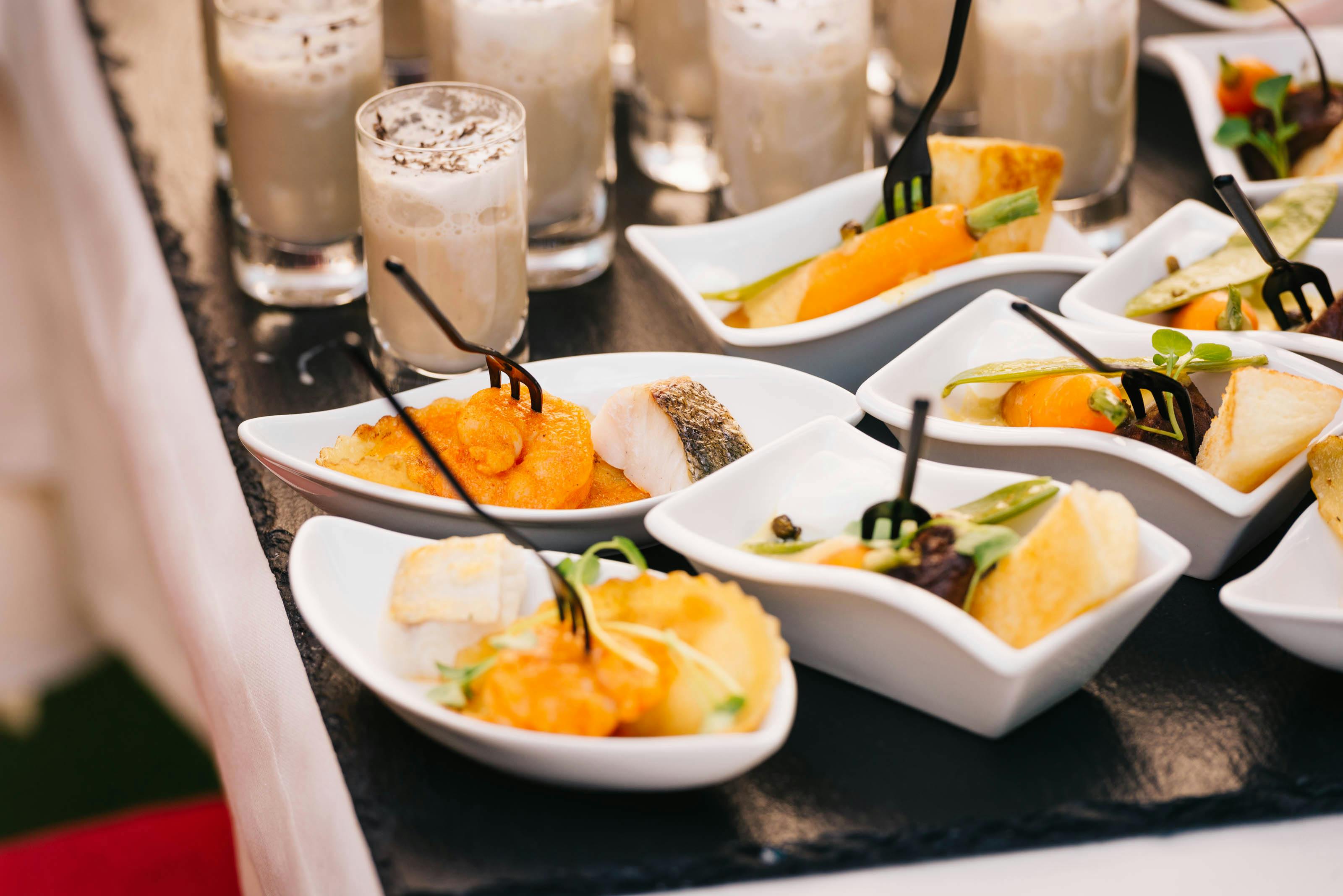 a group of plates of food with forks