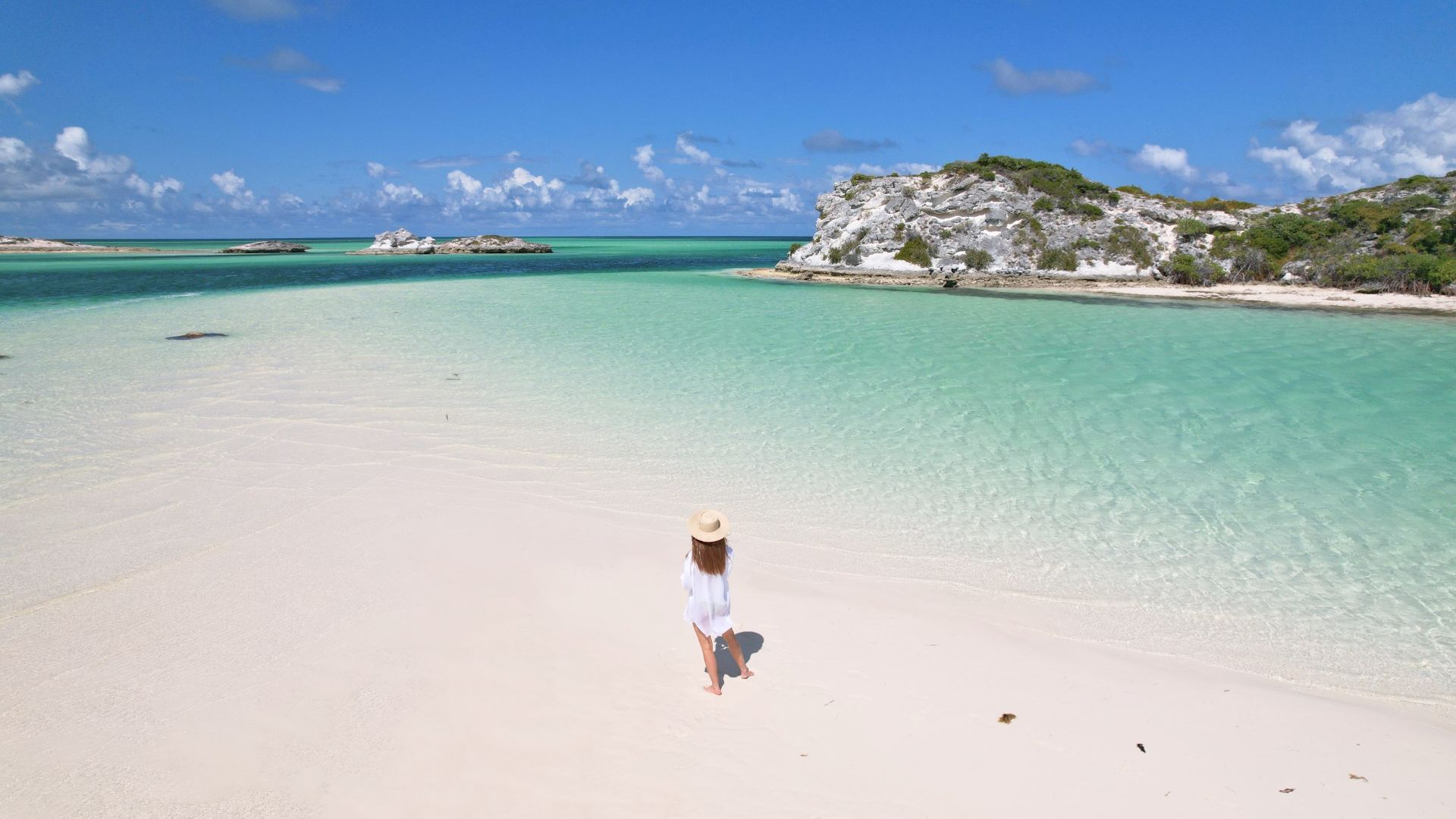 a woman walking on a beach