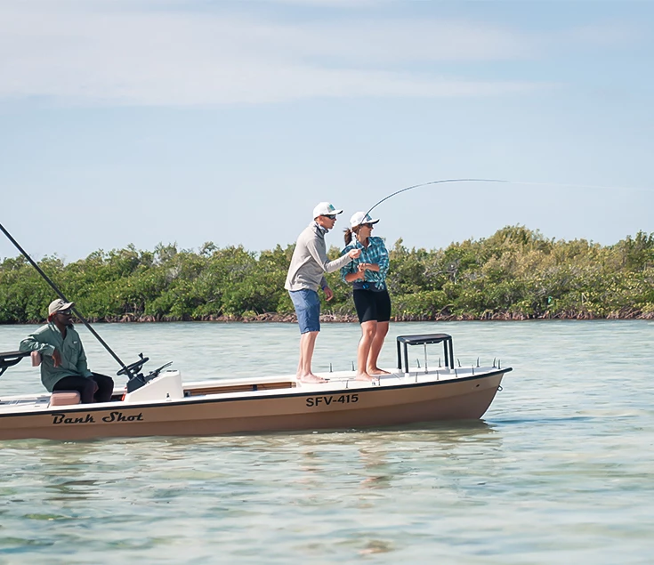 a group of people on a boat fishing