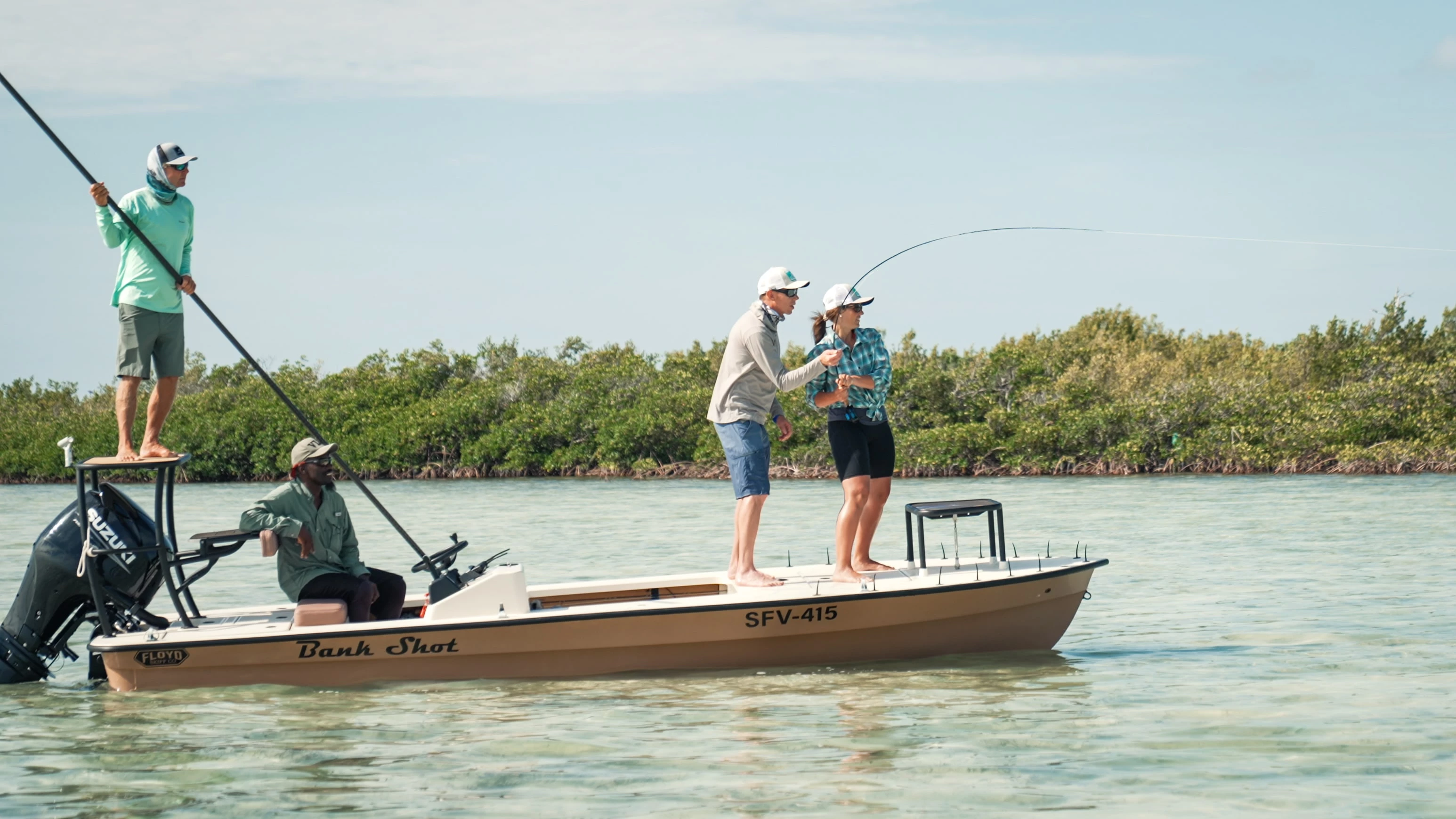 a group of people on a boat fishing