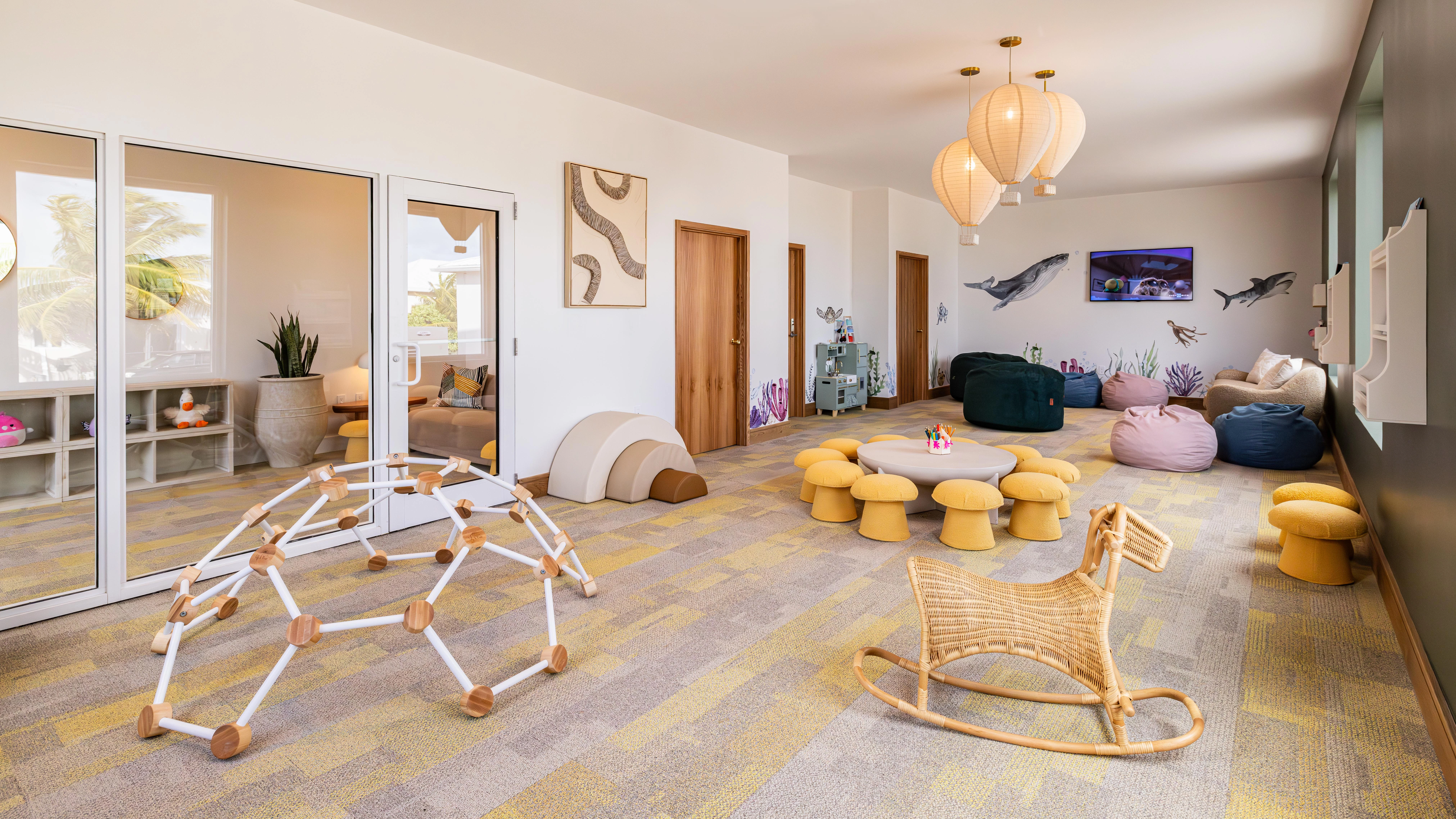 a room with a rocking chair and toys