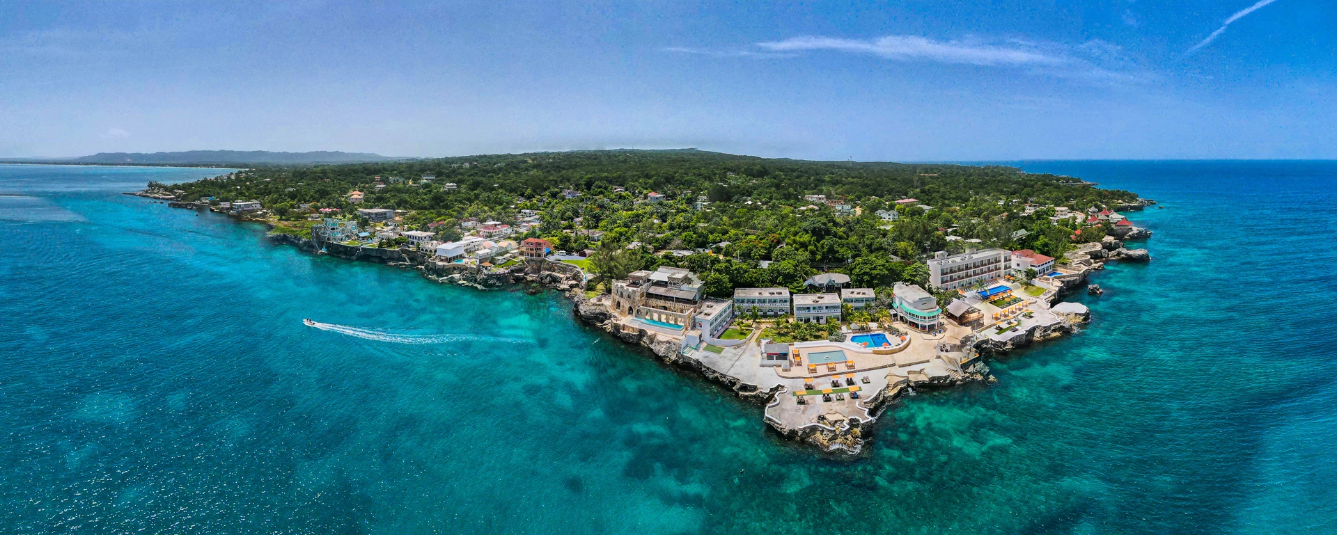 a aerial view of a body of water with buildings and trees