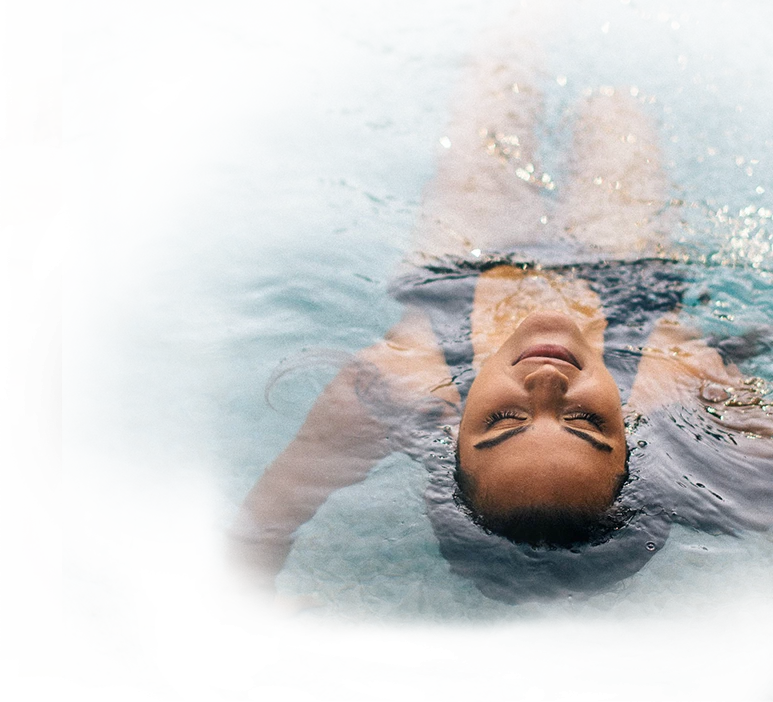 woman in water floating head just above water