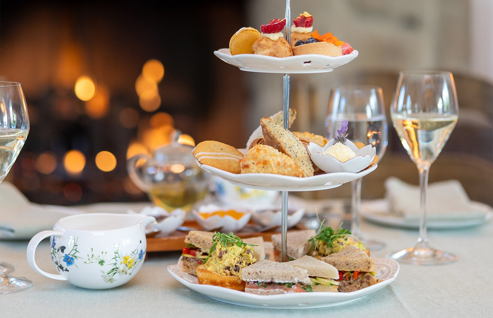 a three tiered tray with food on it