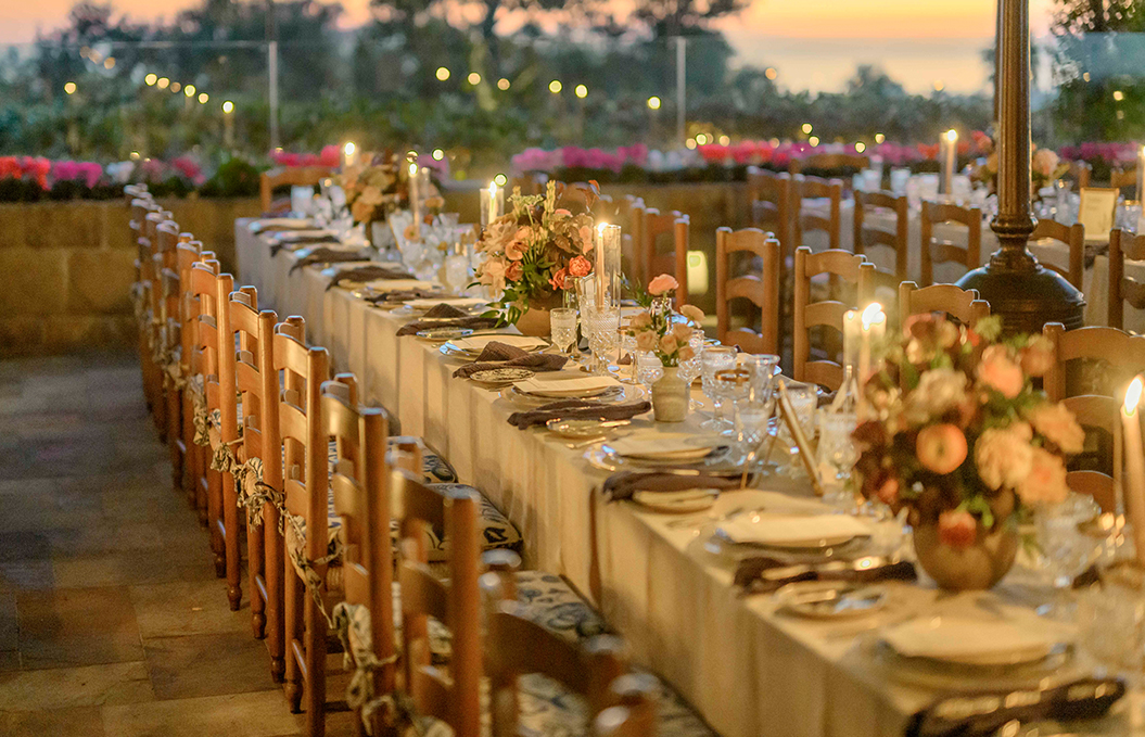 a table with plates and flowers