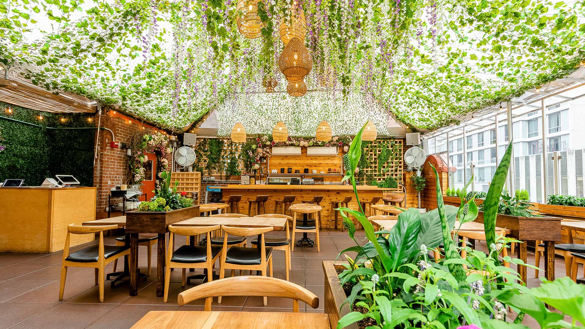a restaurant or bar with a green ceiling and many tables and chairs