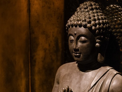 a statue of a person with eyes closed