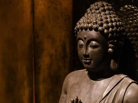 a statue of a person with eyes closed