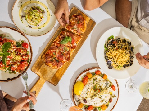 a group of people eating food at a table