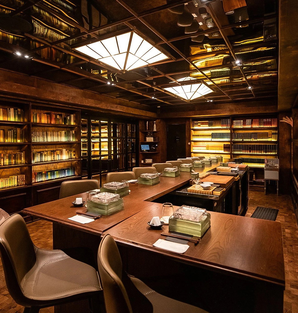 a room with a bookcase and tables