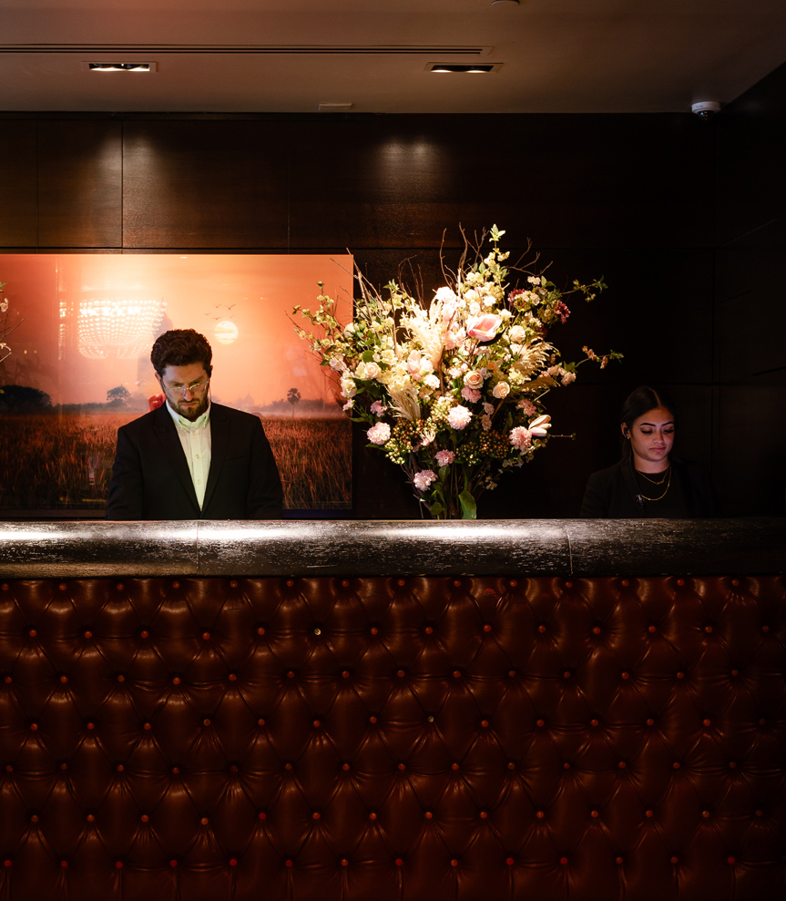 a man and woman behind a counter