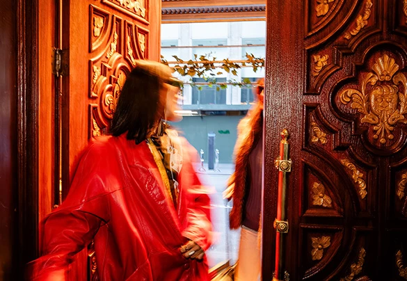 a woman in a red coat