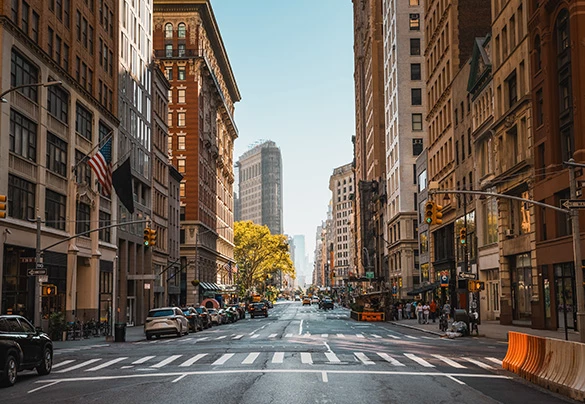a street with cars and buildings