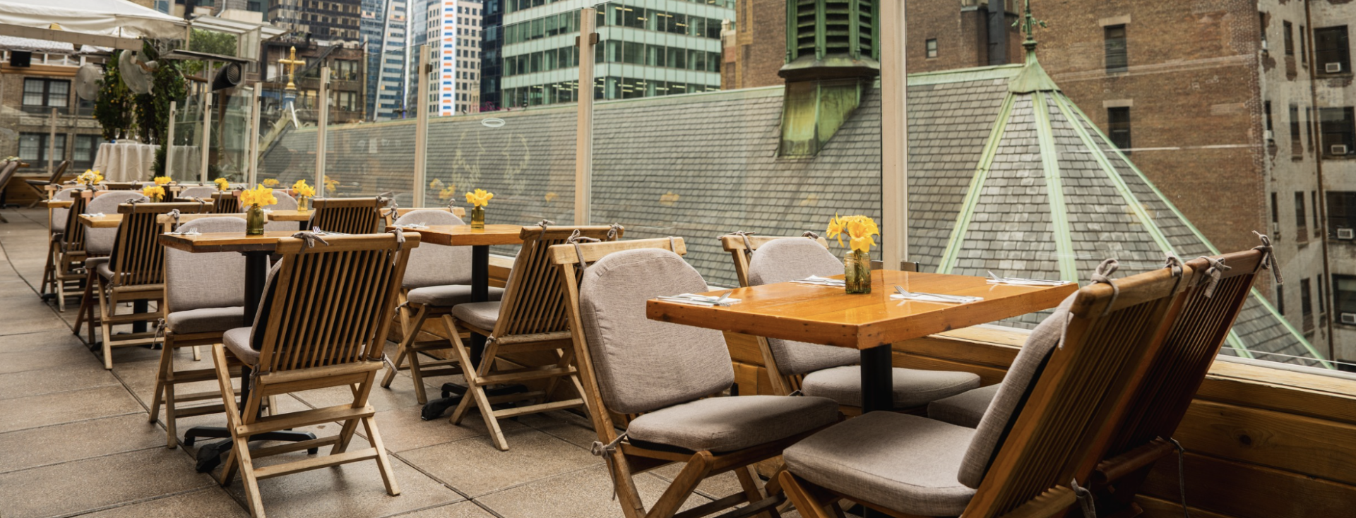 a table and chairs on a rooftop