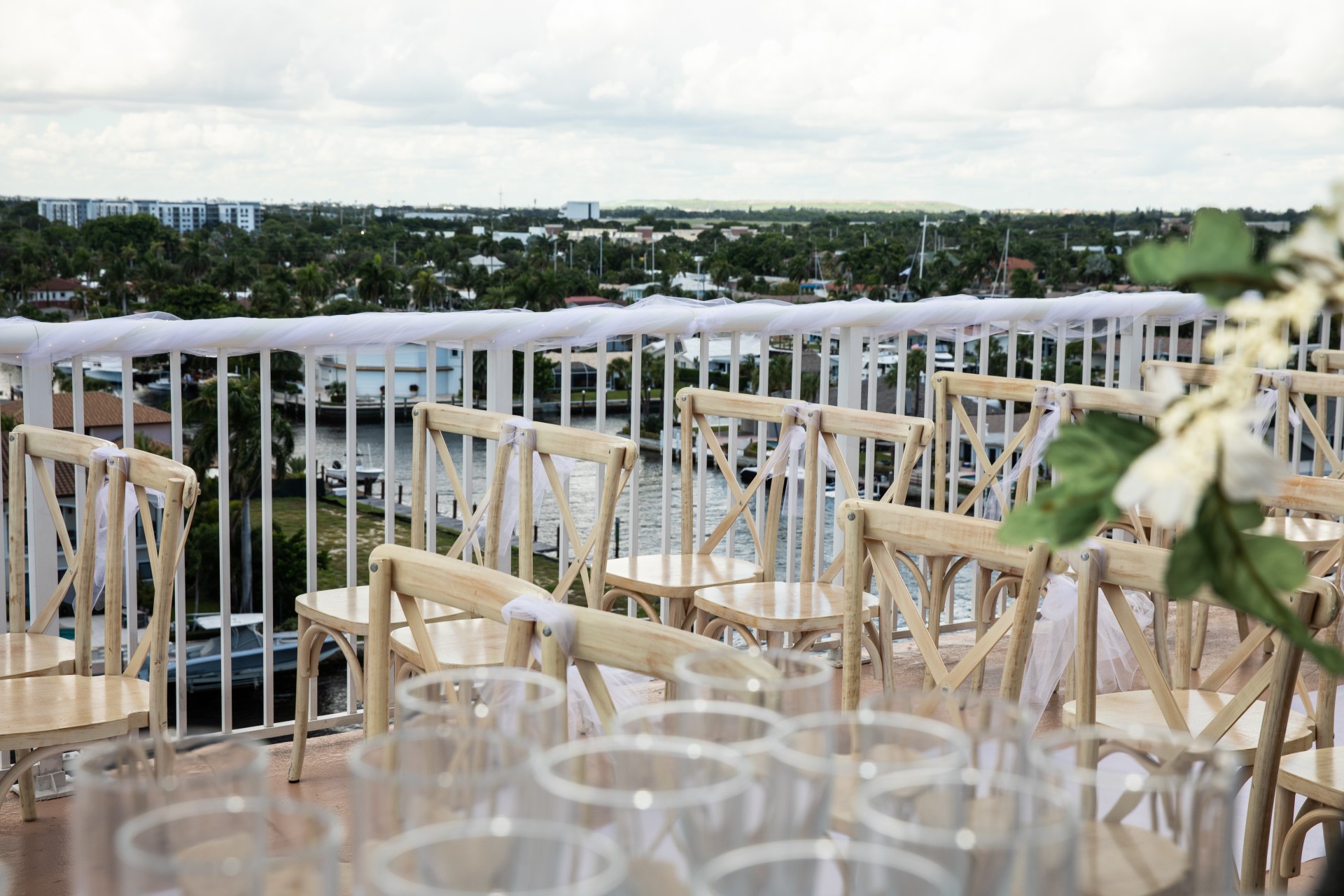 chairs and chairs on a balcony overlooking a city