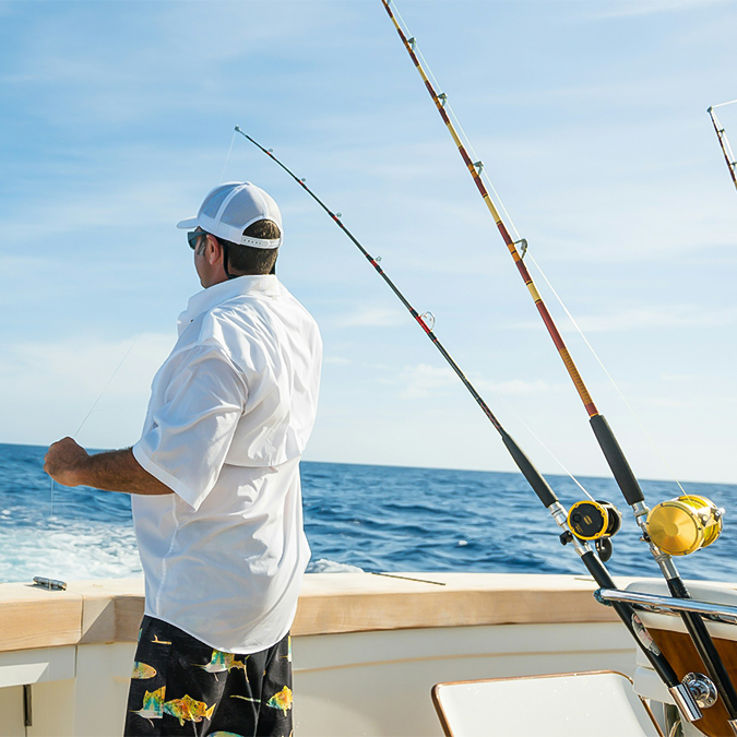 a man fishing on a boat