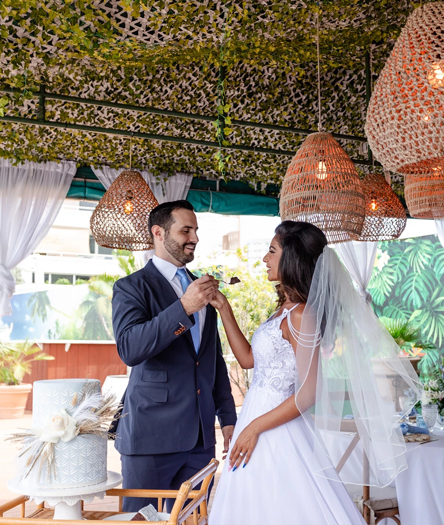 a man feeding a woman a chocolate