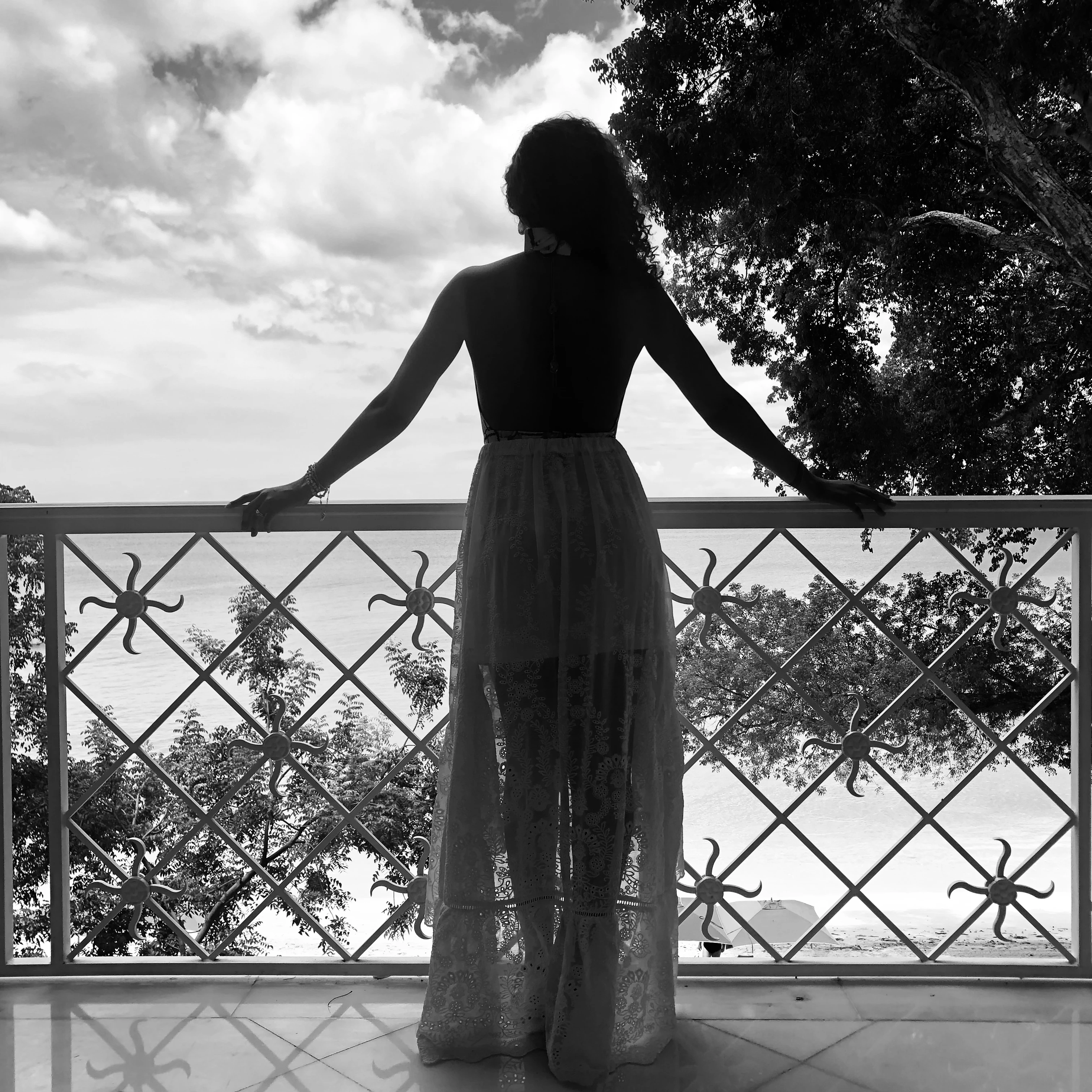 a woman standing on a balcony
