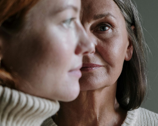 a woman looking at another woman