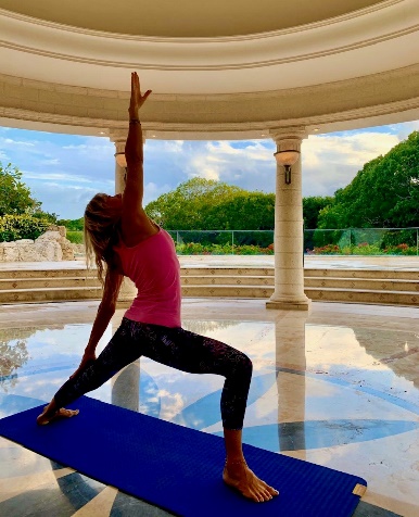 a woman doing yoga in a gazebo