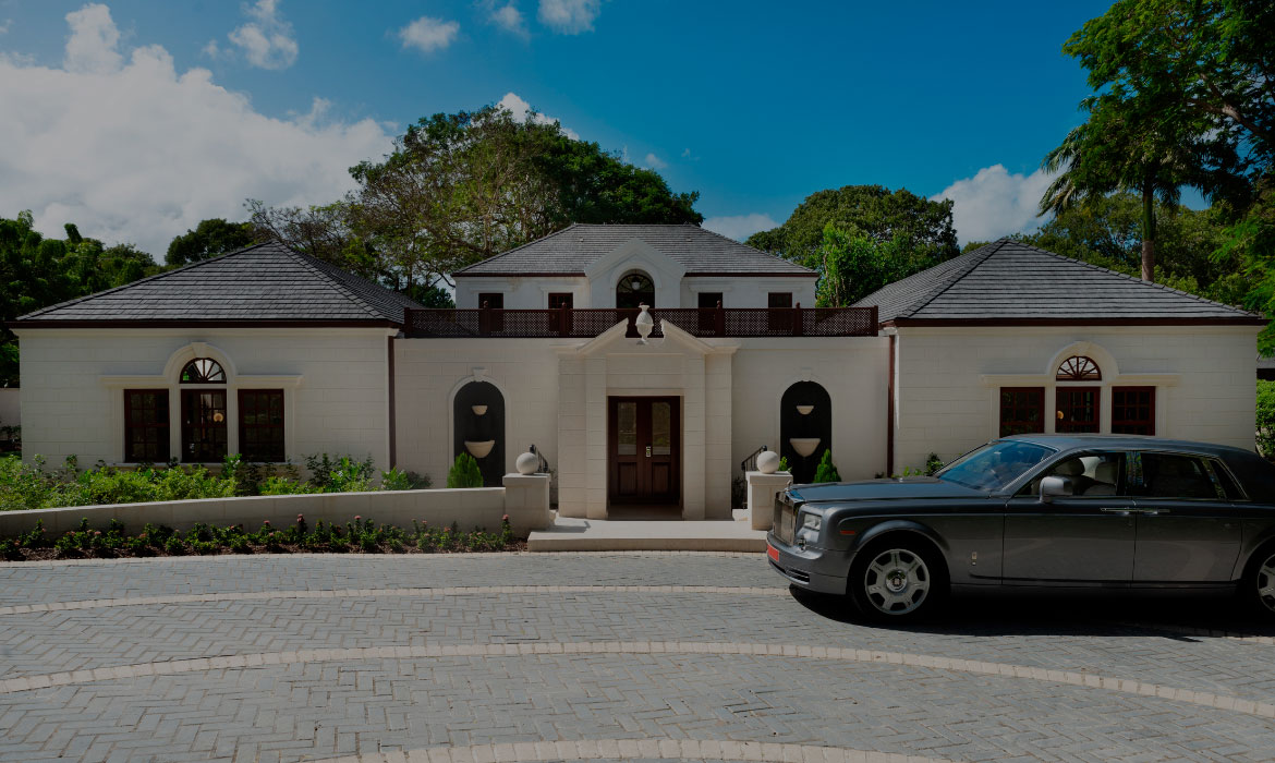 a car parked in front of a house Next