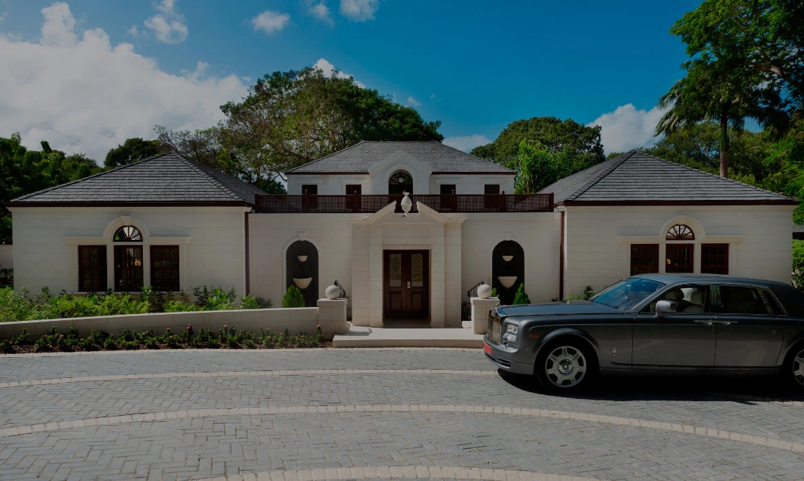 a car parked in front of a house Next