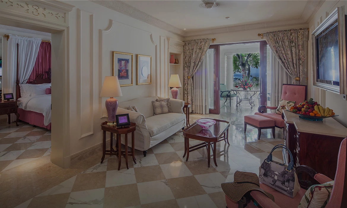 Decorated lounging room area with fruit bowl on countertop Next