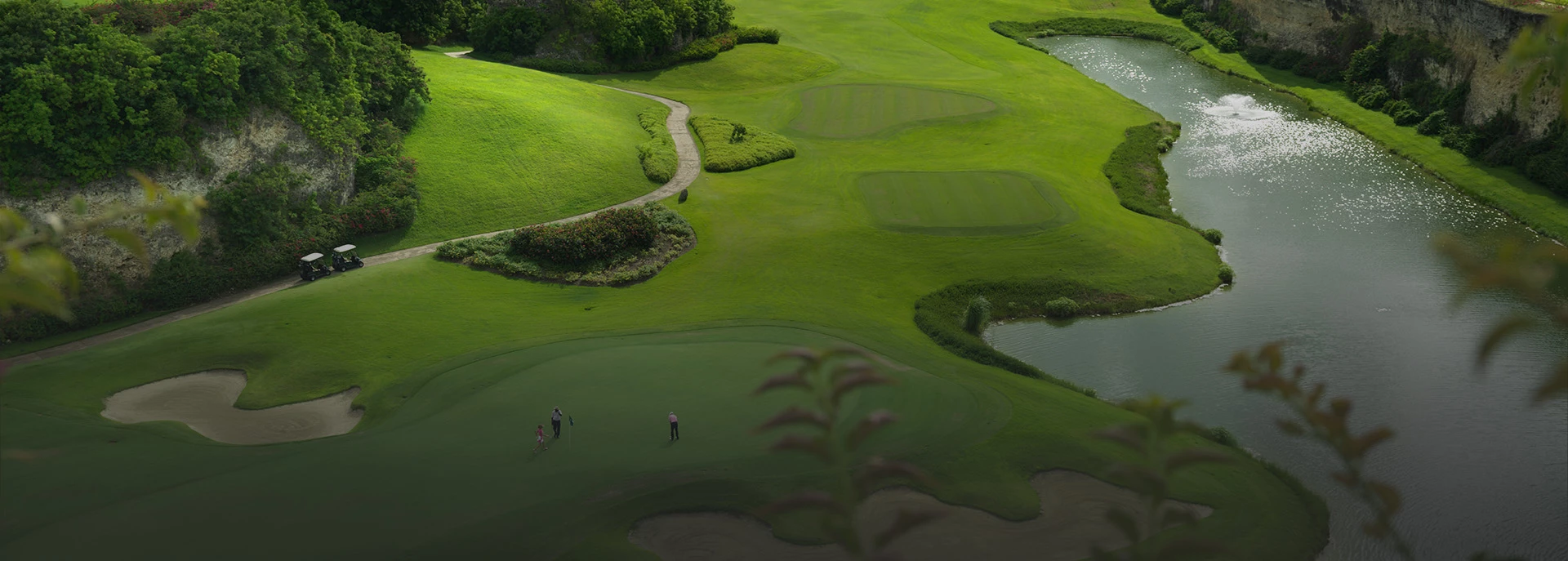 group of people playing golf together at sandy lane