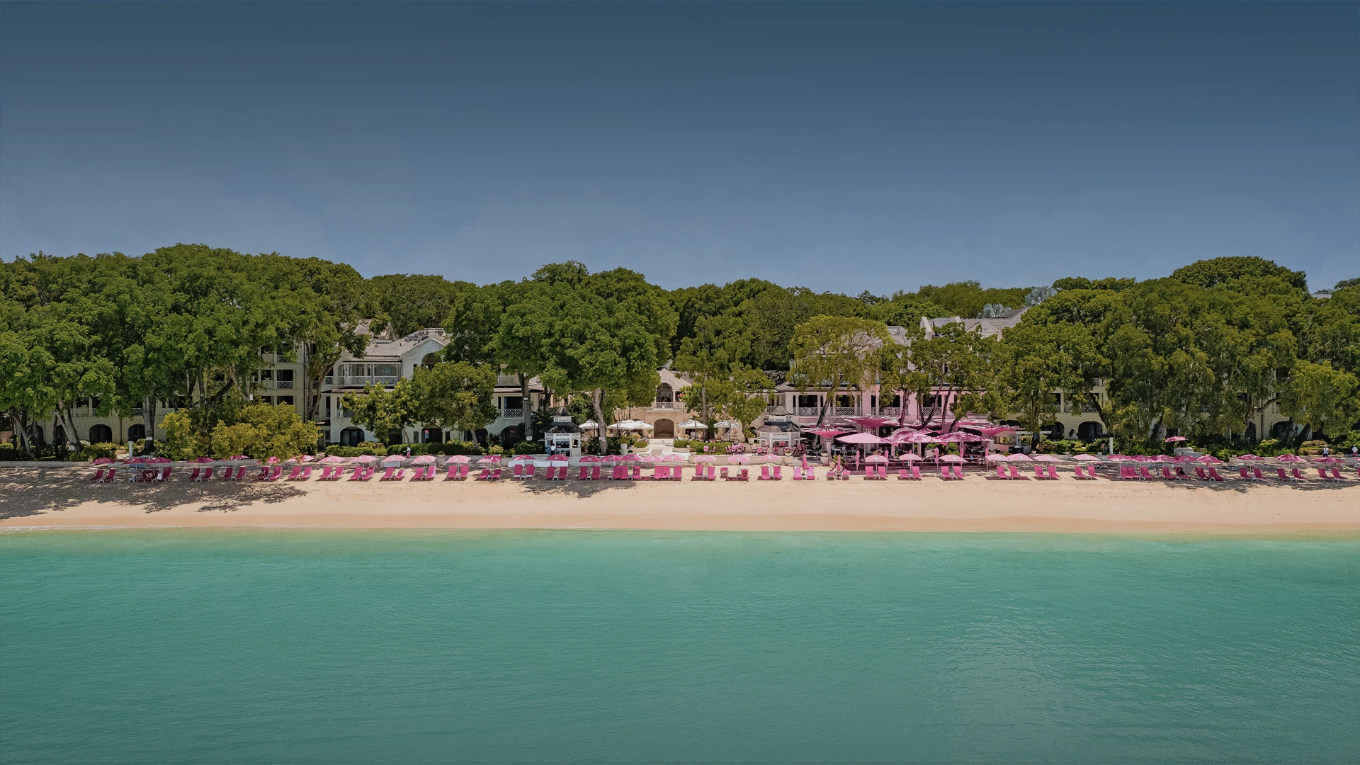 a beach with many chairs and umbrellas