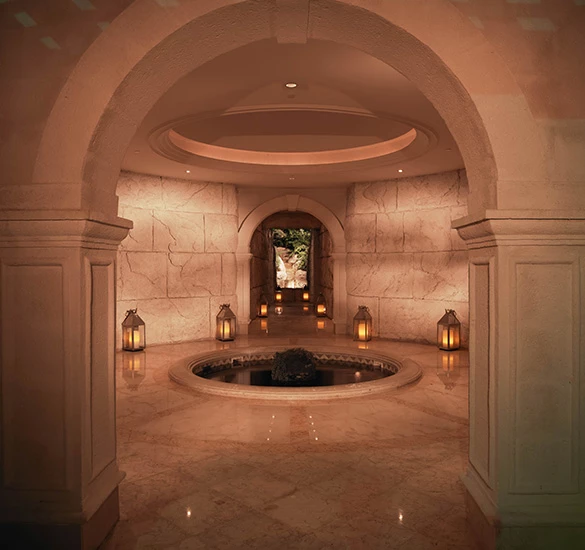 spa entrance with a small pond in the middle