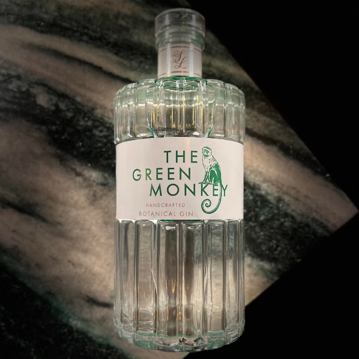 a bottle of alcohol on a marble surface