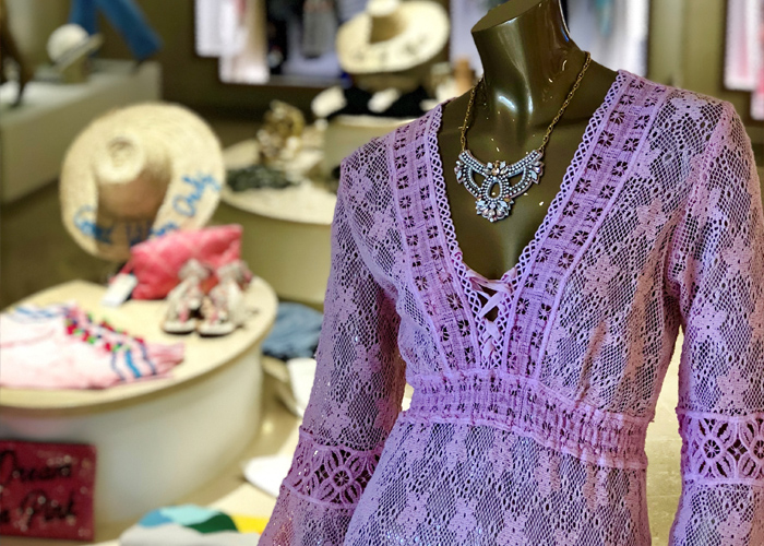 a purple dress and necklace