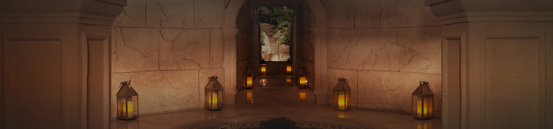 dark spa hallway with candles on the floor