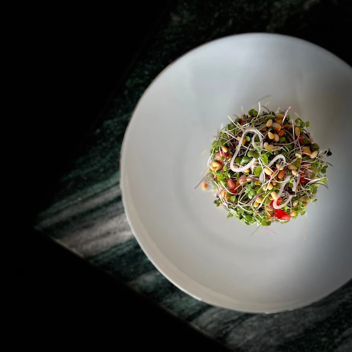 a plate of crispy duck salad on a table