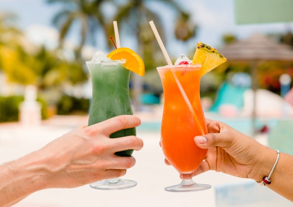 a pair of hands holding drinks