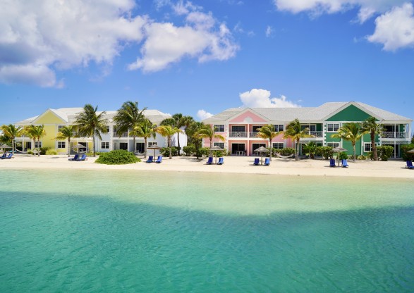 a row of houses on a beach