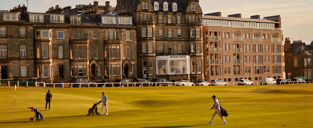a man walking on a golf course