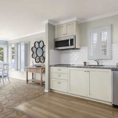 a kitchen with a table and chairs