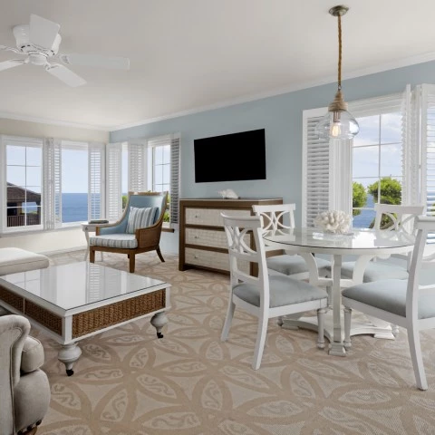 a living room with a television and a table